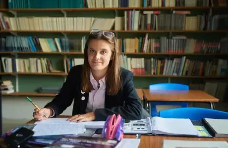 Rendcomb College student studying in the library