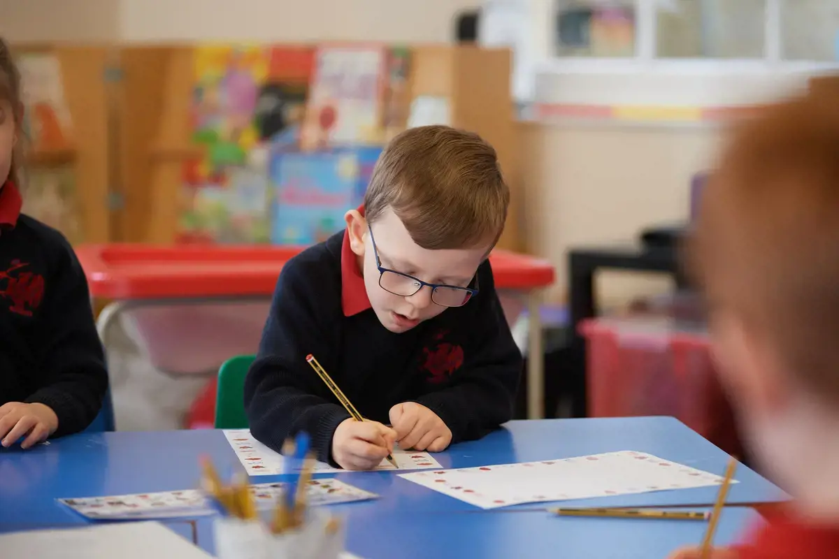 Boy studying in classroom