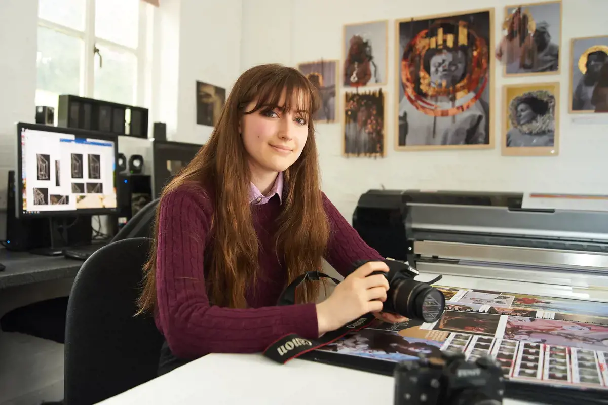 Sixth Form girl holding a camera